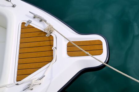 Top shot of bow of white speed boat on waterの写真素材