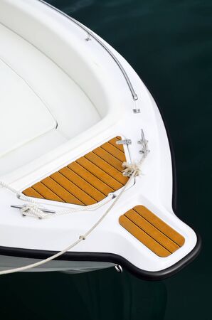 Top shot of bow of white speed boat on waterの写真素材
