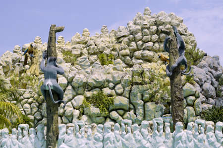 Sculpture of monkeys and parrots in a pool resortの写真素材