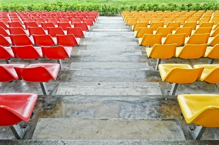 Red and tellow bleacher seats in one of the highend racetracks in the Philippines.のeditorial素材