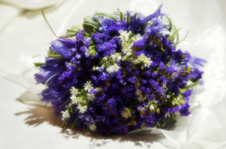Wedding bouquet made of white and violet flowersの写真素材