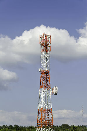Countryside communication tower against cloudy skyの写真素材