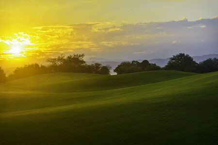 Golden sunrise on golf greens, Philippinesの写真素材