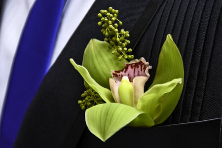 Green flower boutonniere for groomの写真素材