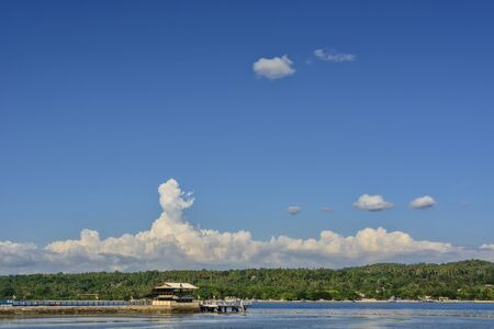 Tropical island jetty in Southern Philippines against clear blue skyの写真素材