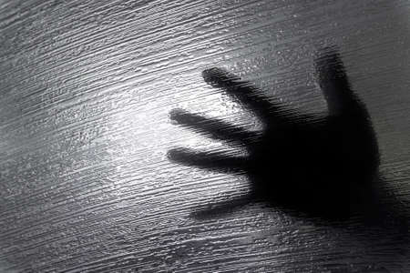 Abstract glass texture of room divider with handの写真素材