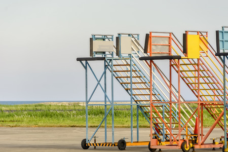 Row of parked airport service stairwaysの写真素材