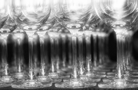 Black and white image of empty water gobletsの写真素材