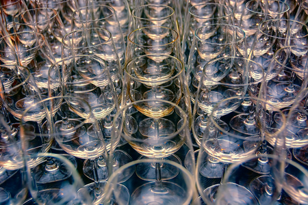 Rows and rows of empty water goblets in restaurantの写真素材