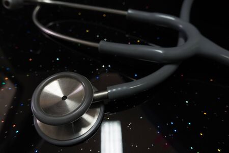 Stethoscope on blue, reflective backgroundの写真素材