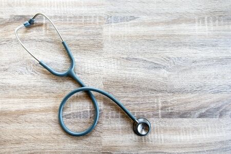 Medical Insurance Concept With Stethoscope On Wooden Deskの写真素材