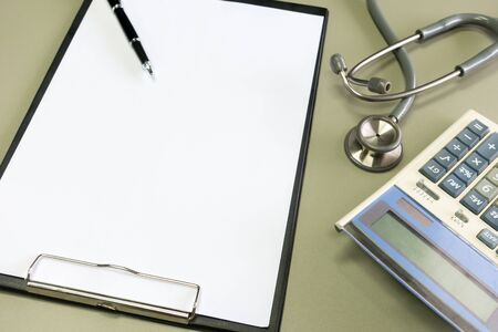 Stethoscope with clipboard  on desk,Doctor working in hospital writing a prescription, Healthcare...