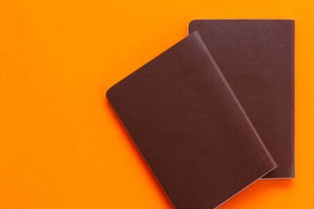 Passport on orange backgroundの写真素材