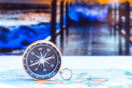 close up compass on paper map, travel and lifestyle, manage to success business technology concept.
