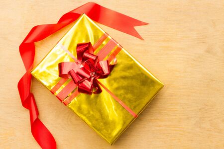 Golden box on wooden backgroundの写真素材