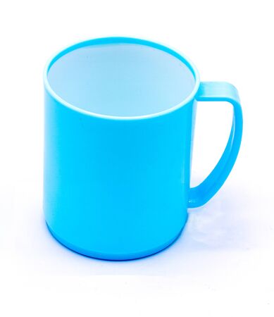 Plastic mug with blue color on white backgroundの写真素材