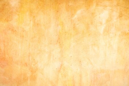 Orange Plastered Walls With Damages. Empty Brickwall With Uneven Surface. A Time Shattered Plaster. Layers Of Building Materials, Plaster, Cement, Whitewash and Bricks.の写真素材