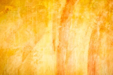 Orange Plastered Walls With Damages. Empty Brickwall With Uneven Surface. A Time Shattered Plaster. Layers Of Building Materials, Plaster, Cement, Whitewash and Bricks.の写真素材