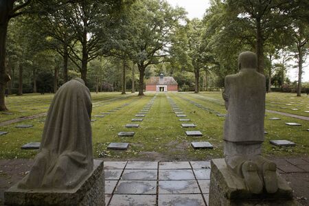 The German World War One war cemetery of Vladslo near Ploegsteert in Belgium and its statues of a grieving mother and fatherのeditorial素材