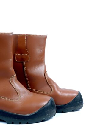 a pair of brown leather boots isolated on white background