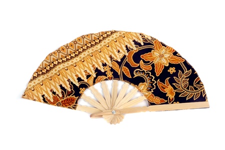 a folding fan patterned batik cloth isolated on white backgroundの写真素材