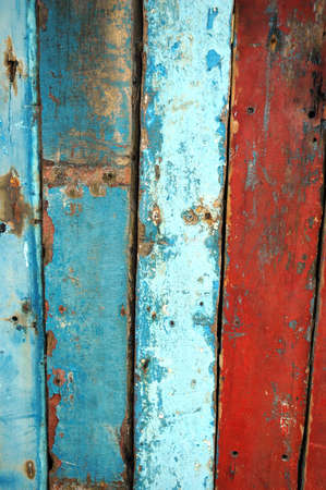 texture of the orange wall that has old wooden boards and the paint fadedの写真素材