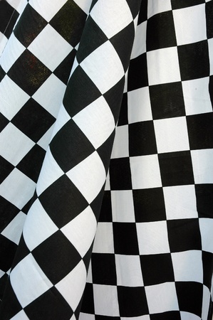 detailed pattern of black and white checkered flag at the start