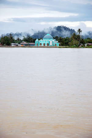 a small mosque on the banks of the river Malinau, Indonesiaの写真素材