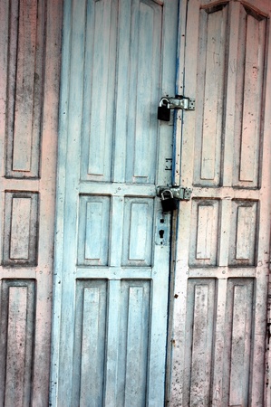 wooden door with a faded paintの写真素材