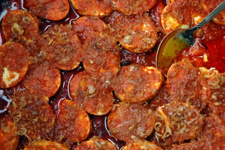 poached eggs with spicy curry backgroundの写真素材