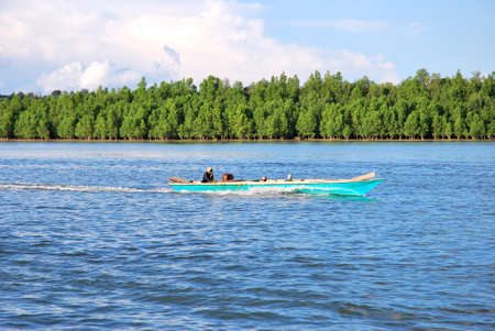 wooden boat wit on the high seasの写真素材
