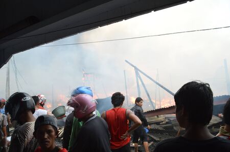 TARAKAN, INDONESIA - MAY 29: Fires in densely populated urban waterfront on May 29, 2013 at Tarakan, Indonesia のeditorial素材