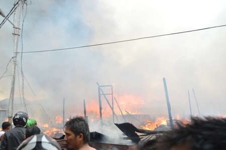 TARAKAN, INDONESIA - MAY 29: Fires in densely populated urban waterfront on May 29, 2013 at Tarakan, Indonesia のeditorial素材