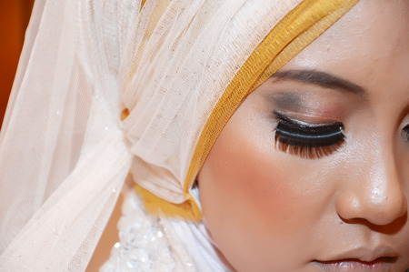 Indonesian's bride was makeup in preparation for the marriage ceremonyの写真素材