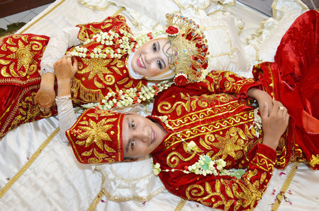 Indonesian bridal couples were pose in their roomの写真素材
