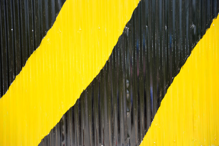 black and yellow strips on the wallの写真素材
