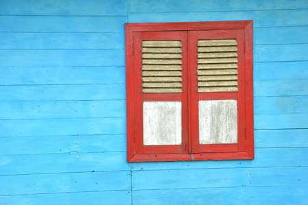 wooden windows on the blue wooden wallの写真素材