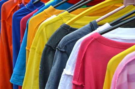 T-shirts drying on hangersの写真素材