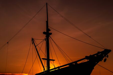 silhouette wooden ship at sunsetの写真素材
