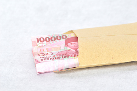Indonesian paper money in a brown envelope