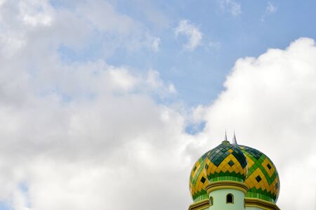 the dome of mosque against blue skyの写真素材