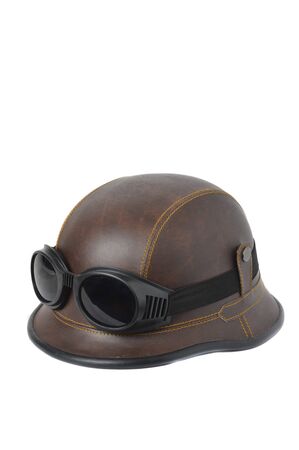 old brown leather helmet witht goggles on white backgroundの写真素材