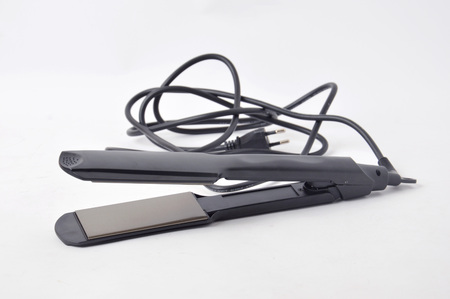 hair straightening tool on white background