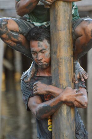 TARAKAN, INDONESIA. August, 27, 2017, Areca climbing competition In order to enliven the celebration of the 72nd anniversary of the Indonesian republic in Tarakan Cityのeditorial素材