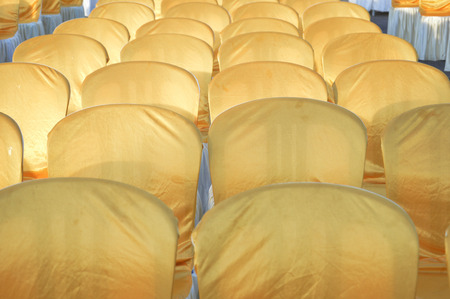 row of chair with golden sheath
