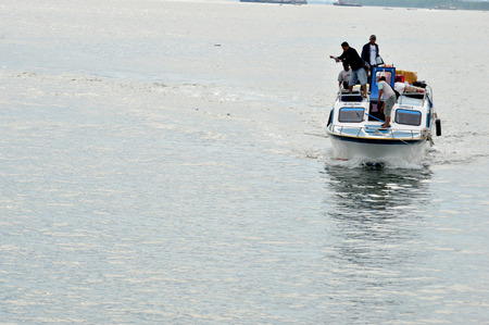 TARAKAN, INDONESIA - MAY, 30, 2016 : a speedboat loading passengers from outside the island of...
