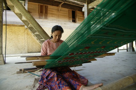 TORAJA, INDONESIA. 1st July 2009. Toraja old woman traditional cloth weaversのeditorial素材