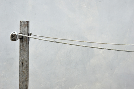 empty clothes clothing line against the wallの写真素材