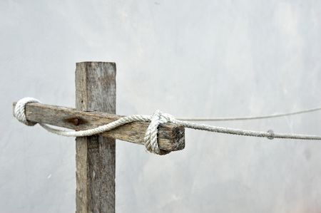 empty clothes clothing line against the wallの写真素材