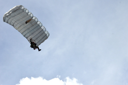 TARAKAN, INDONESIA, 17 DEC 2017 : attraction skydiving in the sky Iraw Tengkayu Festival at Amal Beach Tarakan, Indonesia, in the framework of the 20th anniversary of the cityのeditorial素材